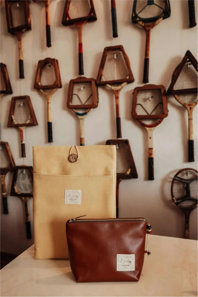 DreamOmni3 result for Change the material of the bag in the red circle to brown leather.